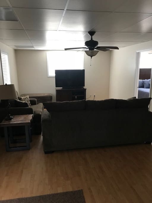 Downstairs Living area with pullout Queen couch, big screen TV, games and more