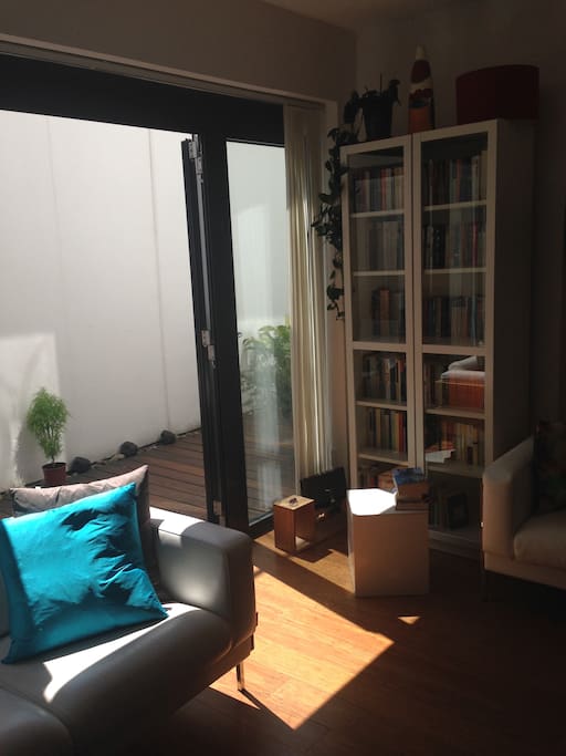 Spacious open plan living room with access to patio.