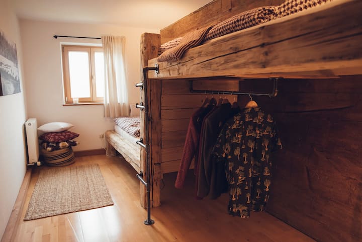 A shared room with mountain views from the pillow