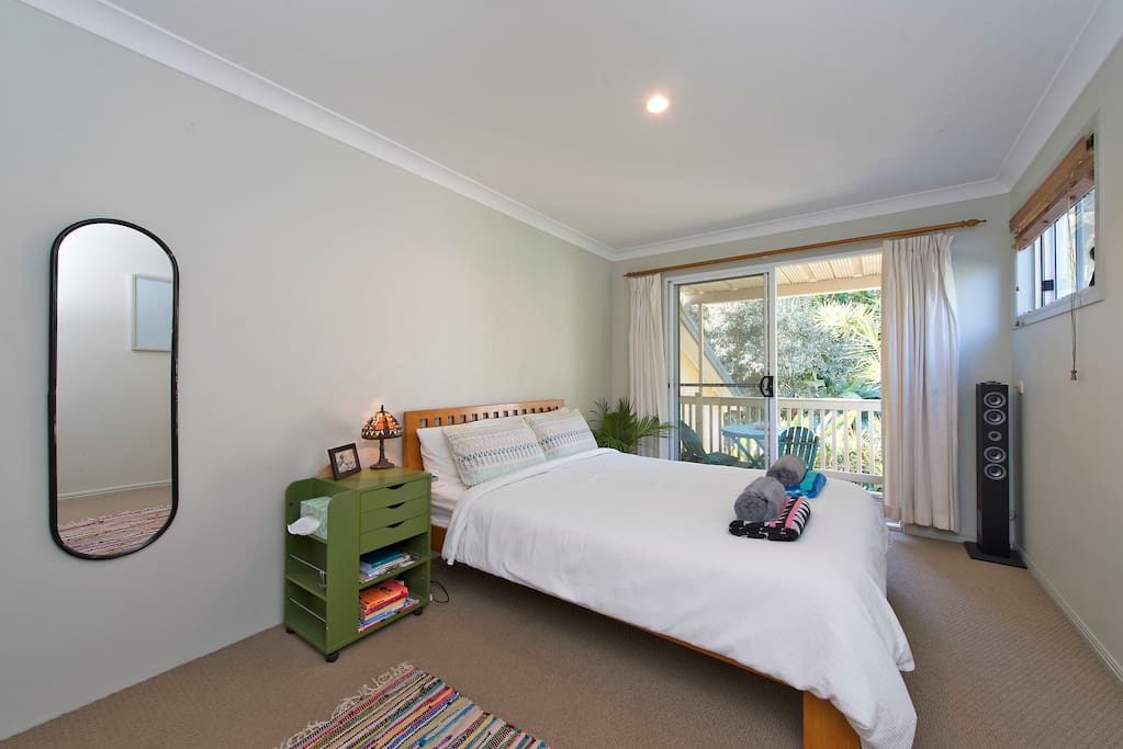 Spacious bedroom with adjoining private deck.