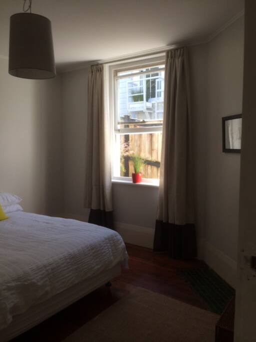 Bedroom with wardrobe and queen sized bed