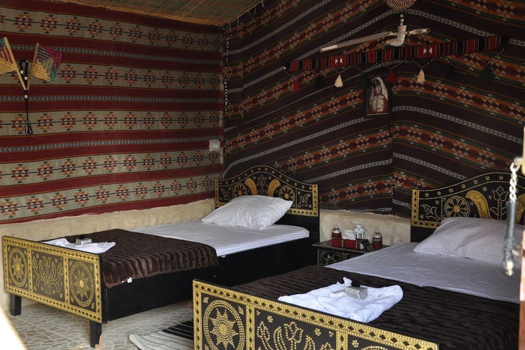 All the tents and rooms represent a unique Arabic Bedouin style. The tents and rooms are equipped with comfortable beds, dressing table, Bedouin chest, carpets, AC, safe box etc.. Each room has its special traditional unique decoration and furniture to ensure the different experience for the continuous customers. Each tent is attached to a well-equipped and hygienic open-top sanitary building with toilet and shower. Additionally, In front of the rooms there is a shaded sitting area to enjoy the beautiful views.