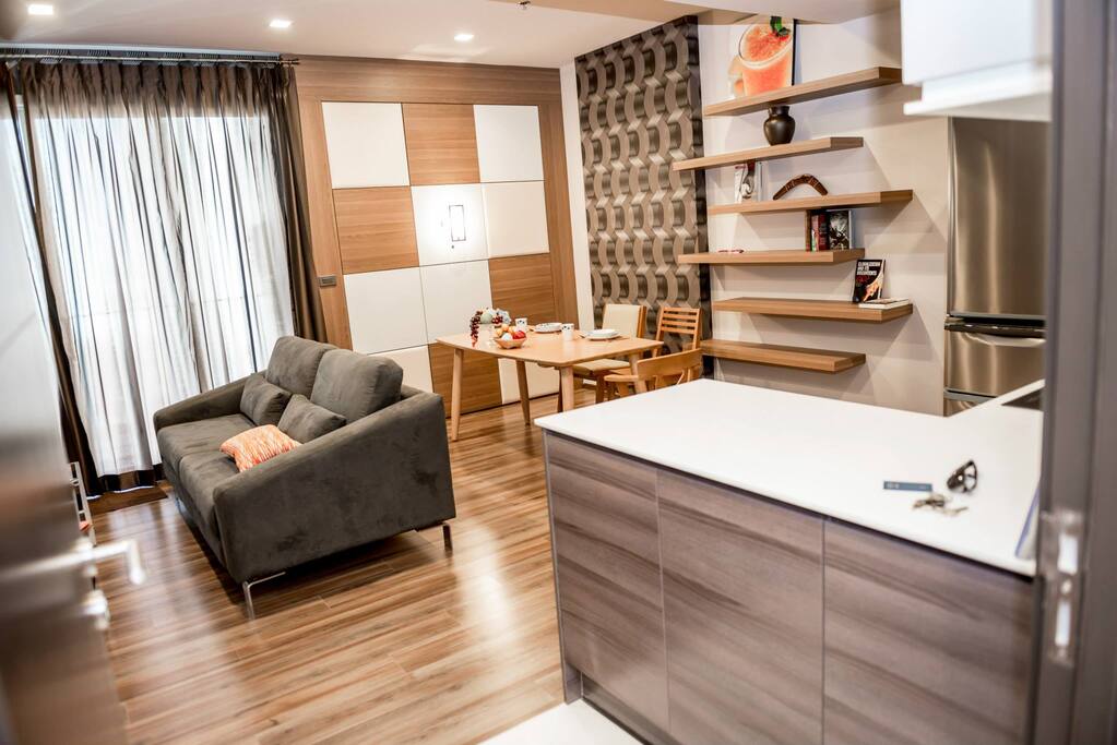 The property is known for higher ceiling than commonly found in a condo. Contrast that with a custom-designed couch