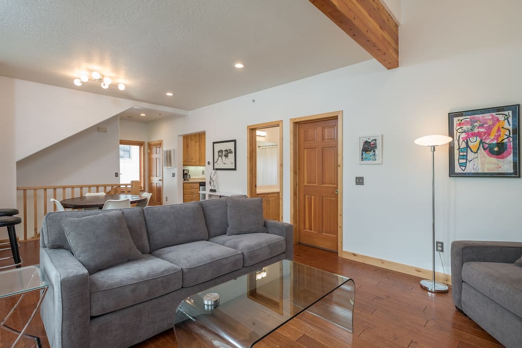 Main level with living room, dining room, kitchen, guest bedroom (queen bed with single bunk), full bathroom and stackable washer/dryer