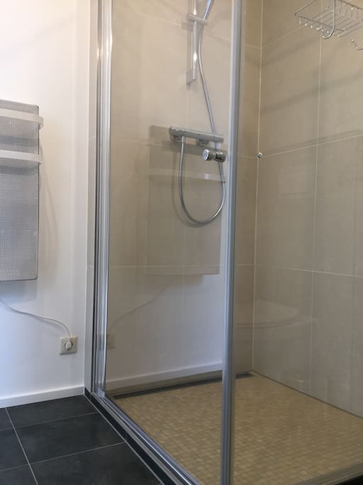 Brand new shower. The heater has 2 rungs to hang your towels to keep them warm while showering.