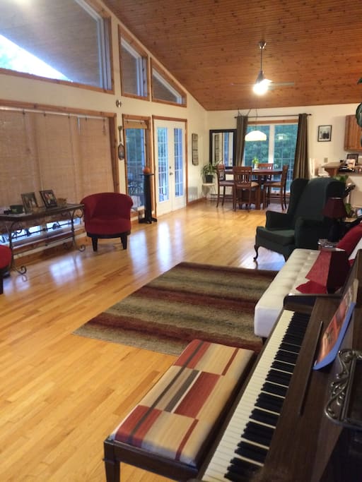 Sit and read or play piano while enjoying the bright, sun- drenched room