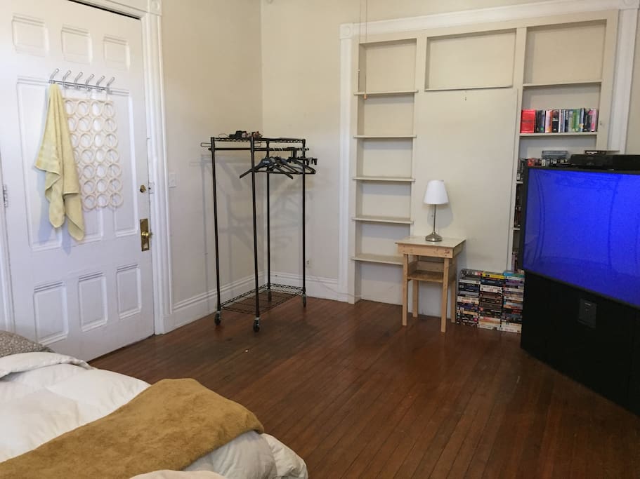 Open clothes rack unit with built in shelving has plenty of character and storage.