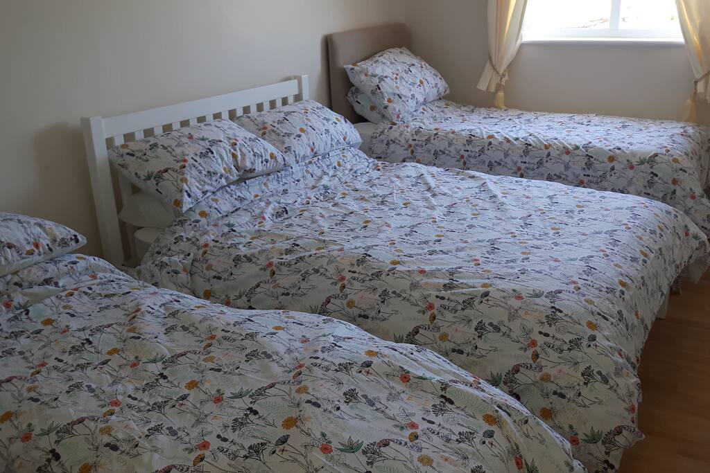 Family bedroom, two single beds and one double.