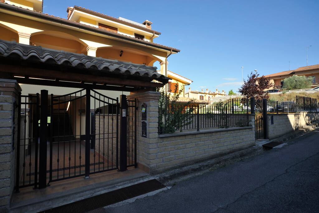 Main entrance (public parking to the right)