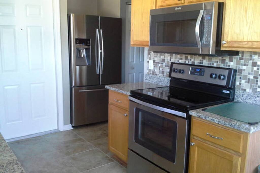 Oak Finish Cabinets w/Brand New Stainless Steel Appliances