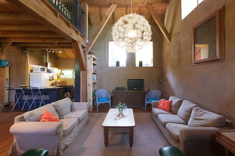 Straw-bale barn style house on small hobby-farm