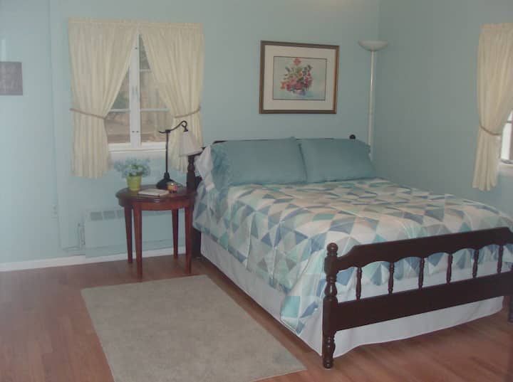 This is a comfy memory foam full size bed and in this room we have added a portable air conditioner for extremely warm days.