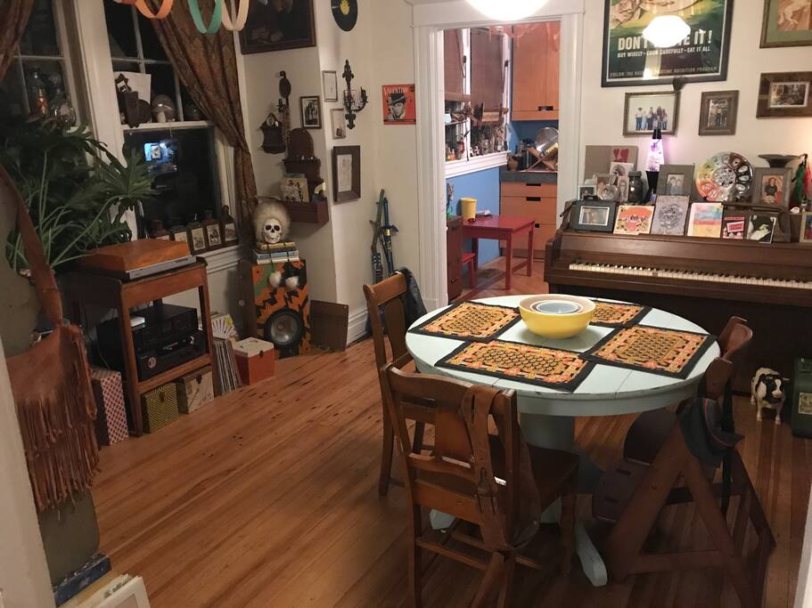 Dining room, piano and stereo.