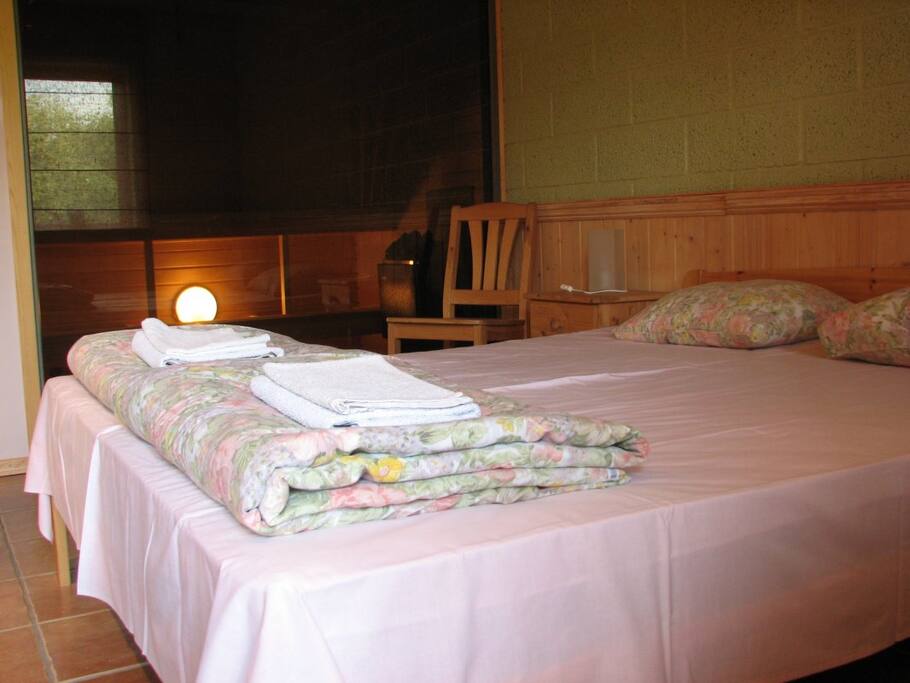 Cozy double bed. If needed we can split it.