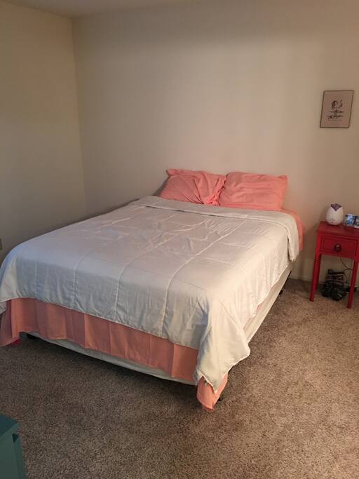 Cozy queen size bed w/ pillow top mattress.