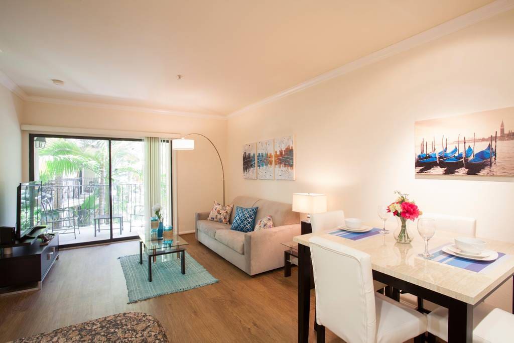 Spacious living room with attached private balcony.