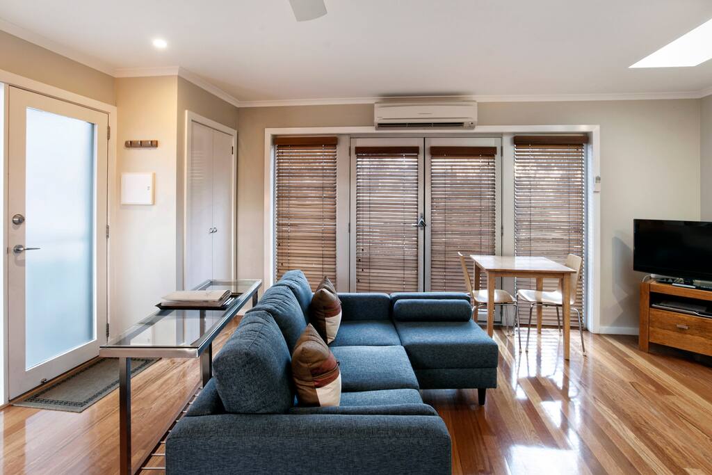 Relax on the couch or open the doors to the Juliet balcony