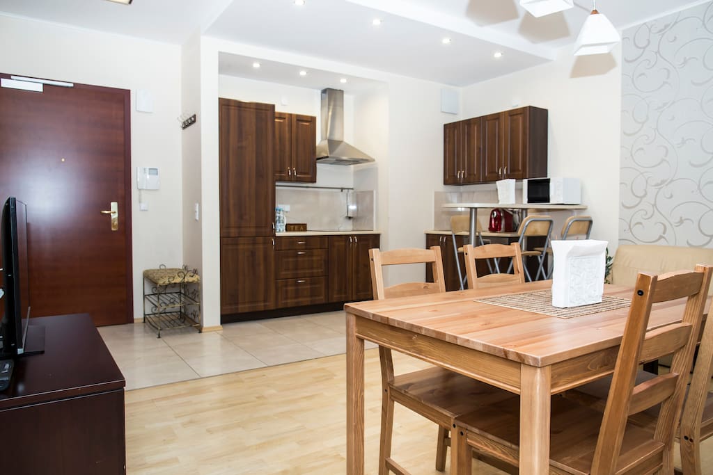 Living room with sofa bed,kitchen and table for 4 people.