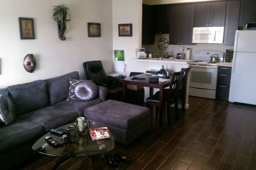 Full size kitchen and open living room concept. Great place to cook and watch 65 inche Flat Sceen TV while entertaining friends and family.