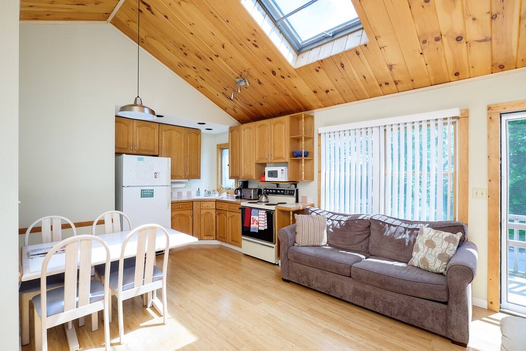 pull out queen sleeper sofa, Open concept kitchen and living area with cathedral ceilings and a sky light window, lots of natural light!