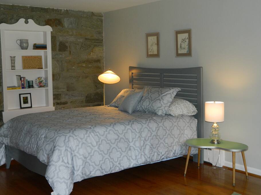 First floor bedroom with direct access to the deck. Chromecast is on television
