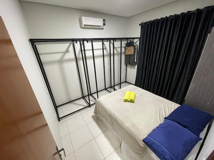 Bedroom Double bed, Air Conditioning, Small wardrobe, and a hanger macaw.