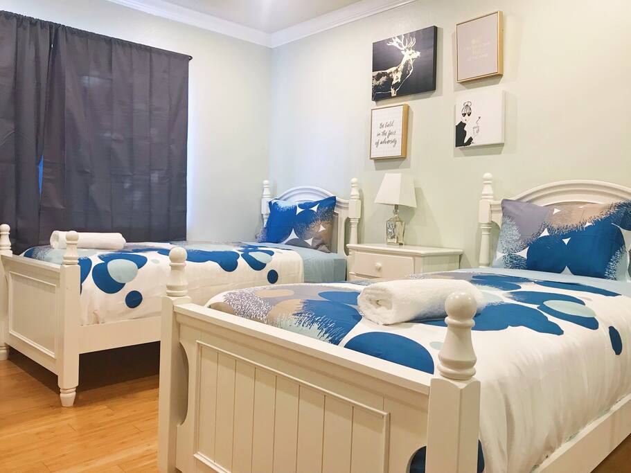 guest bedroom three by the end of the hallway with two twins. Ideal for singles and teens.
