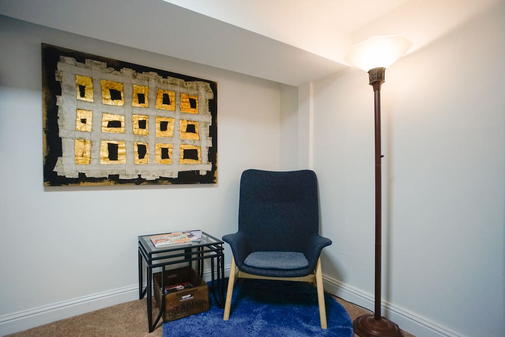 Curl up with a good book in this cozy reading nook. Help yourself to magazines if you need reading material for a flight.
