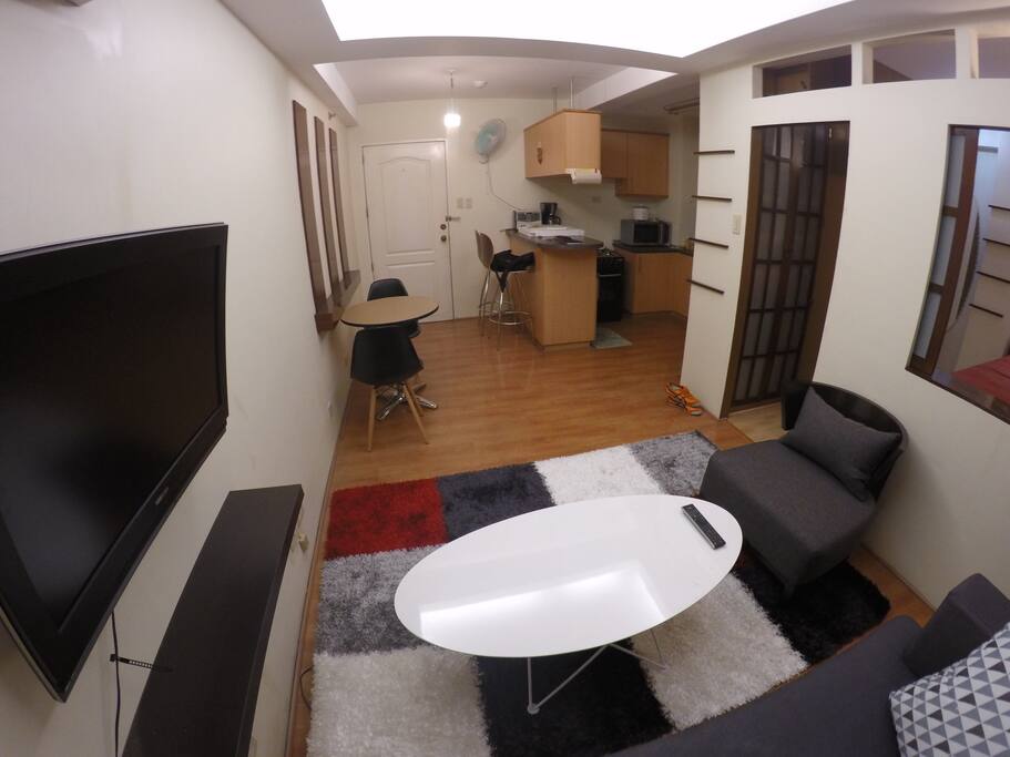 Functional furniture throughout the entire condo was designed to not clutter the place and be practical for the space