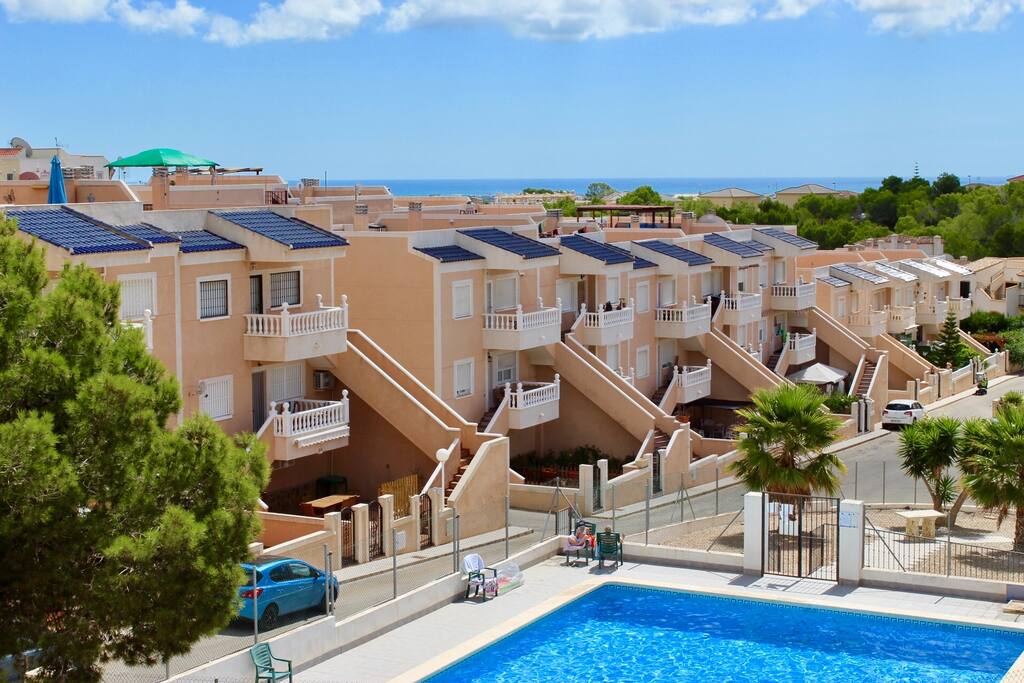 View of pool & coast behind