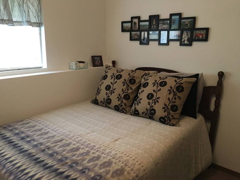 Comfy full-size bed with plenty of pillows