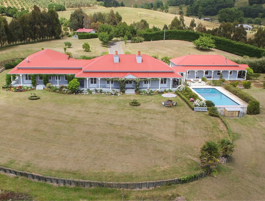 French colonial-style homestead set within 16 acres of gardens and grounds
