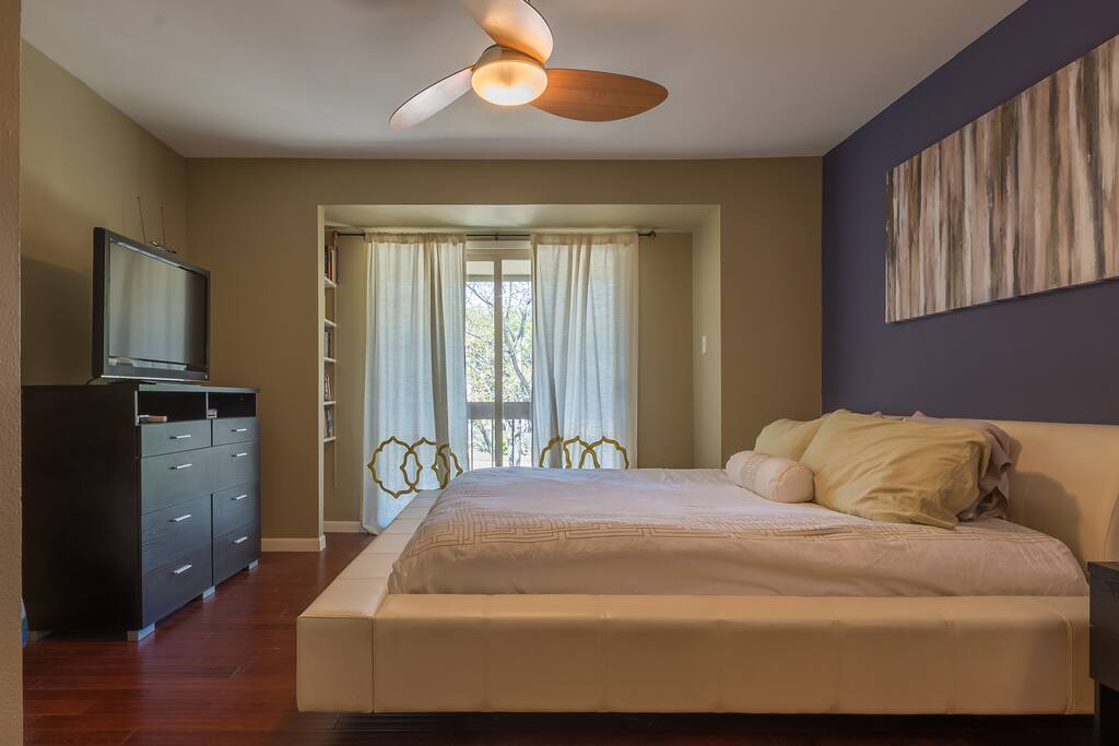 master bedroom upsatirs with king bed (both bedrooms have doors; the loft is separate)