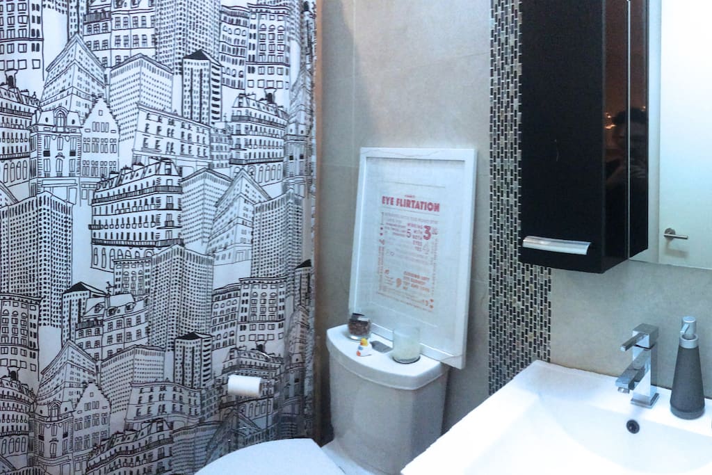 Bathtub and standing shower with rainshower head. Bluetooth speaker / moodlight built into ceiling.