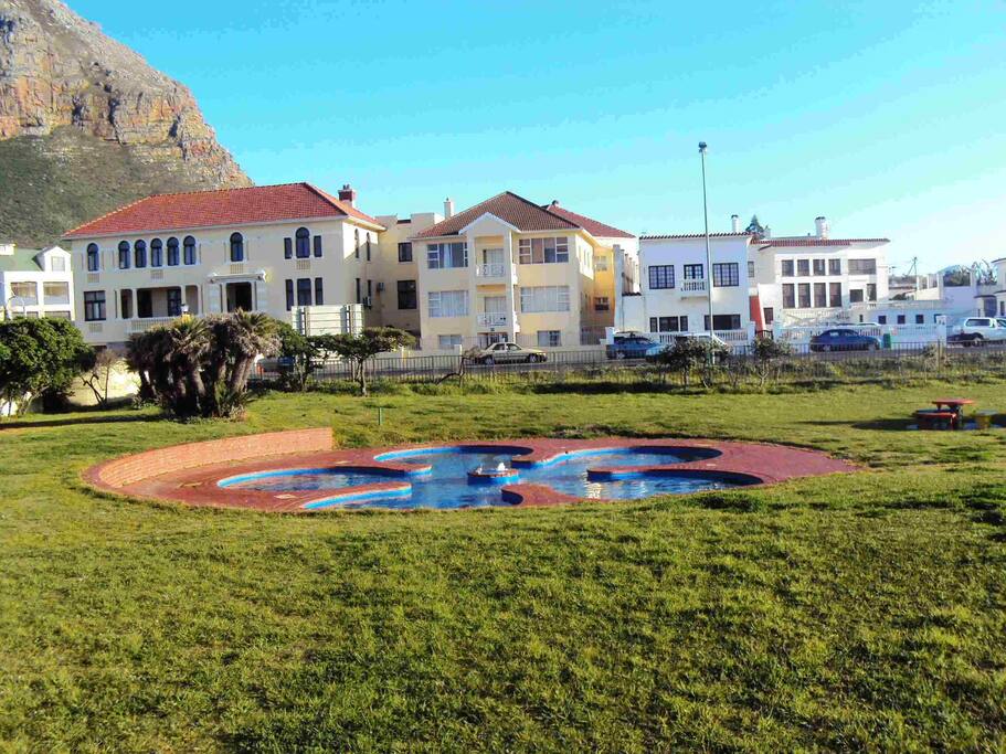 You can find us opposite the pools next to the Muizenberg Pavilion - see the white complex on the back right