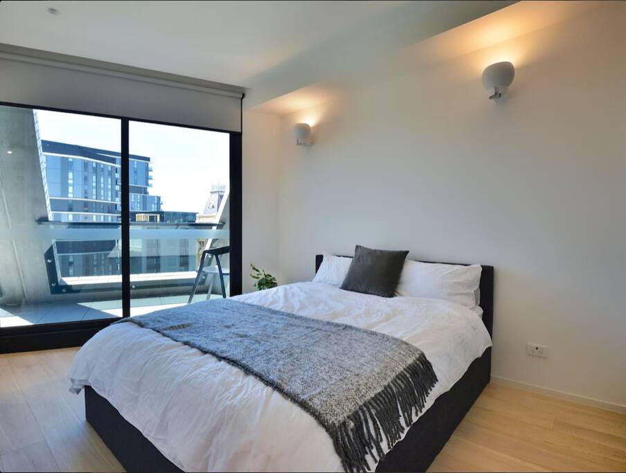 The Master Bedroom - a queen sized bed with cotton sheets, duck down doona and goose down pillows.