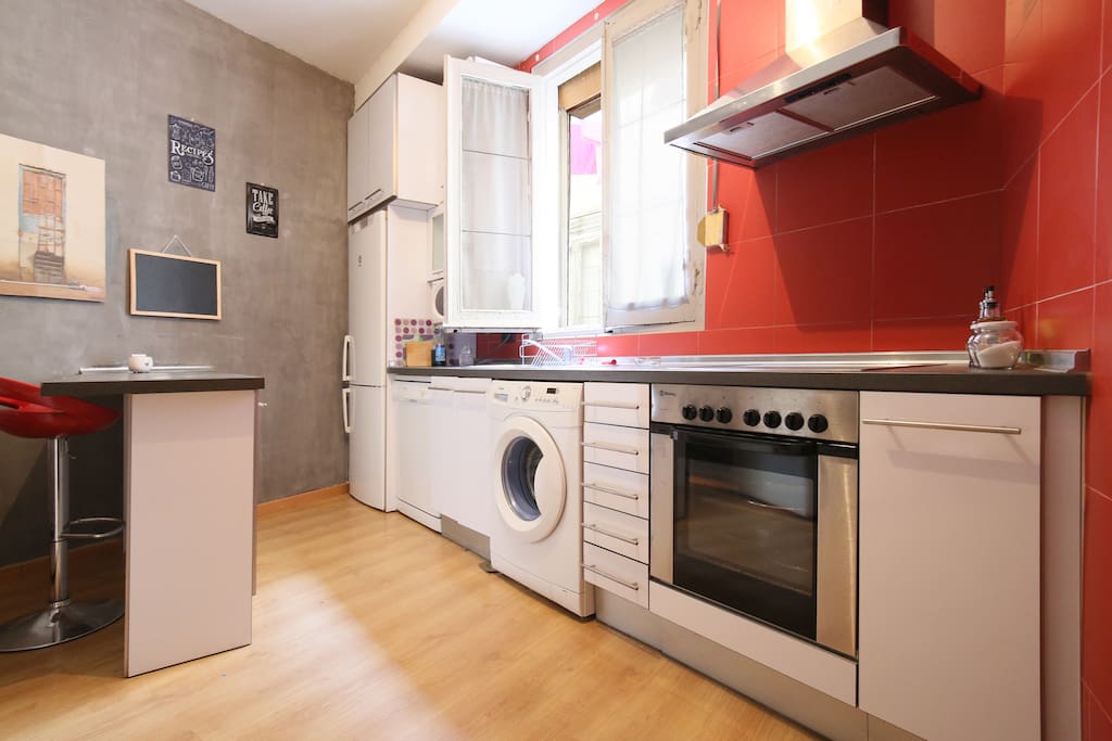 Living room with kitchen, dish washer and laundry machine