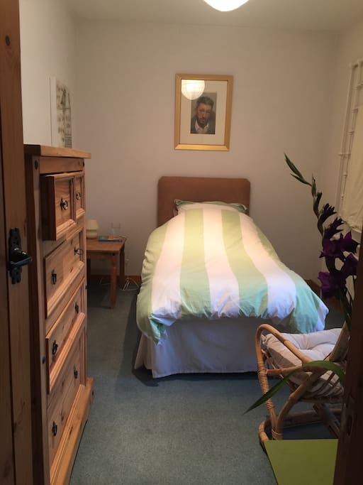 Spacious single room with a few of my original paintings.