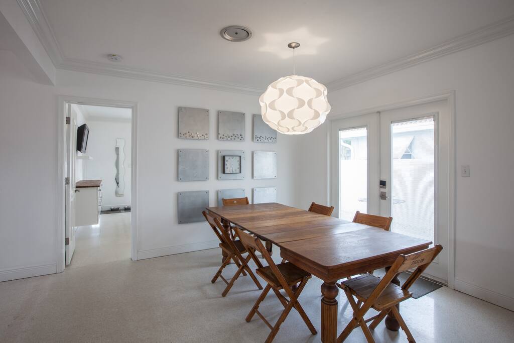 Terrazzo Floors, large dining table, french doors to outside