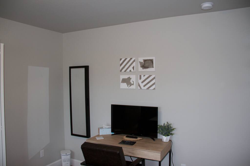 Both bedrooms have natural light & come with modern style writing desks, 32" Smart HD Samsung TVs (Netflix included) & full size mirrors.