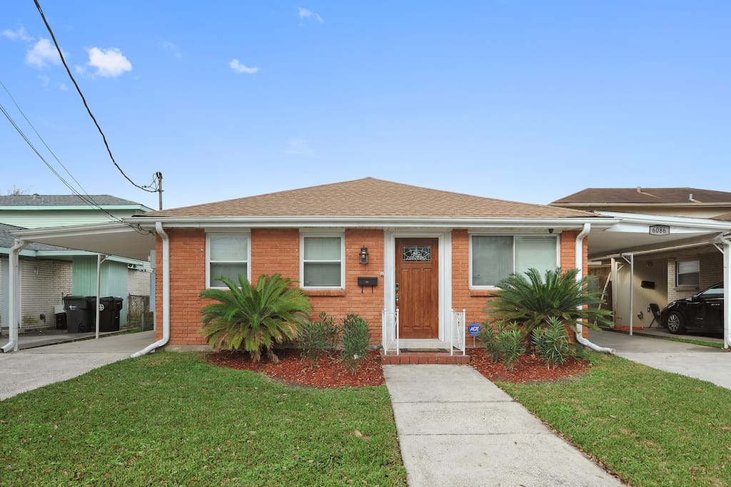 Covered carport provides off street parking.