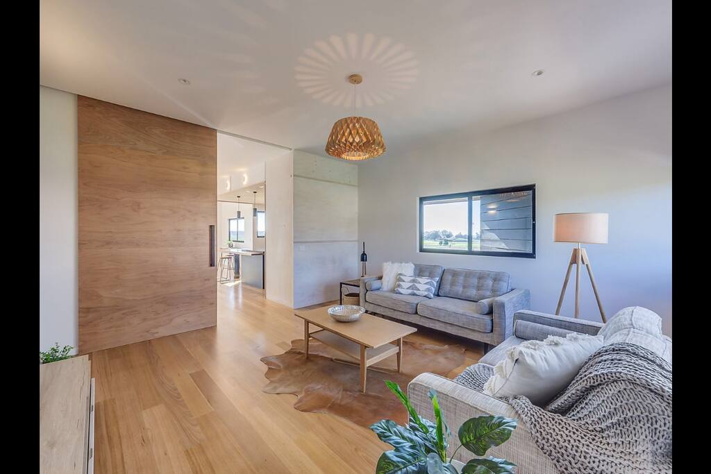 Huge barn door, leave open for view to beach and fauna. reserve through living or close for privacy.