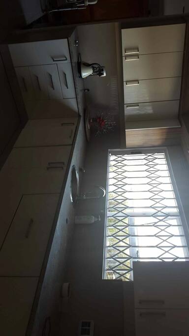 Huge kitchen, lovely open plan entertainment area, wash-up area separate