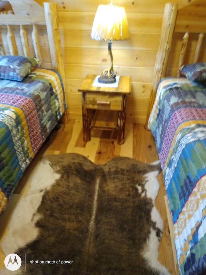 Faux cowhide floor rug.