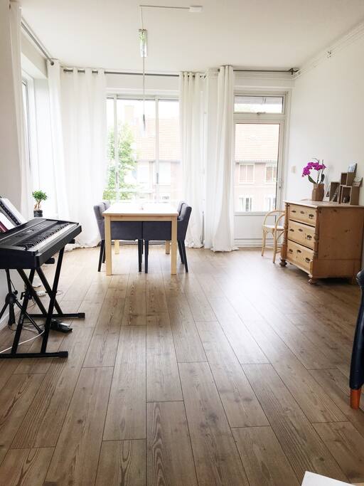 Spacious dining area that leads to a balcony.