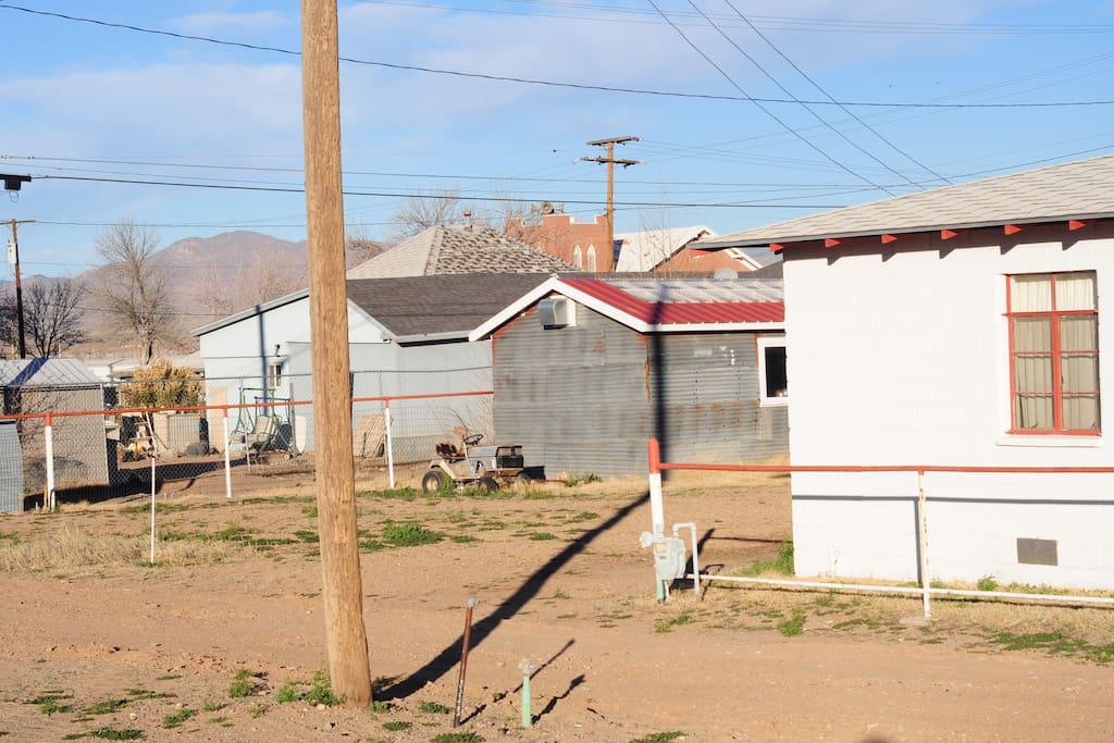 View of back side of house from empty lot next door to studio.
