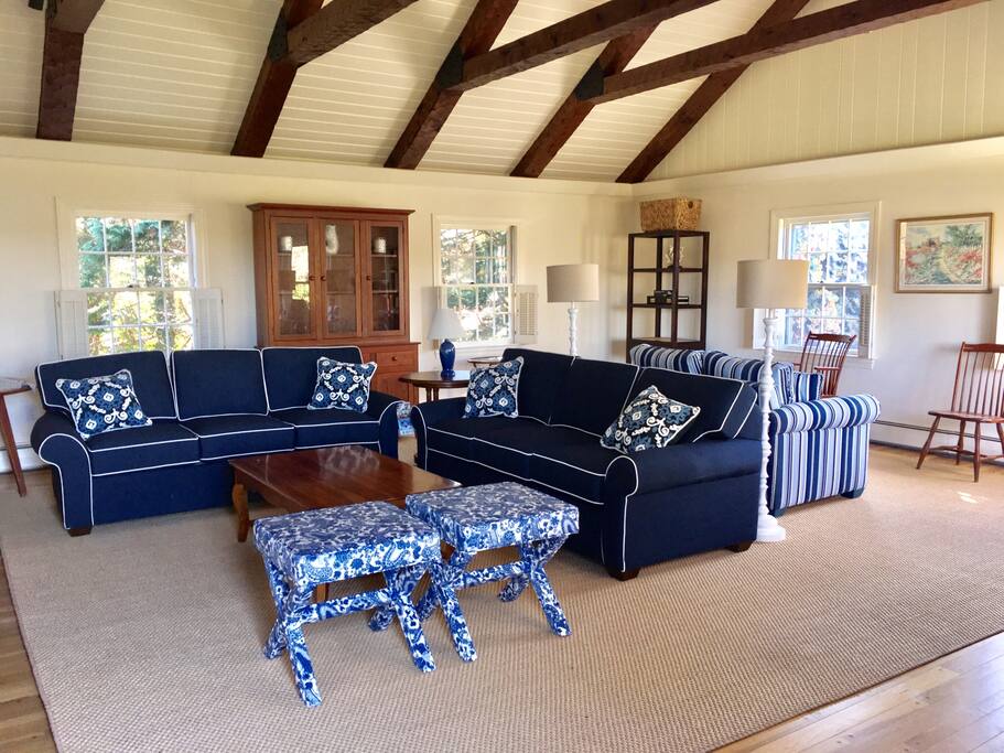 Sunny family room with 60" TV and water views