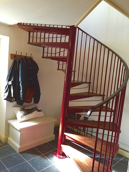 Spiral staircase to kitchen and living room