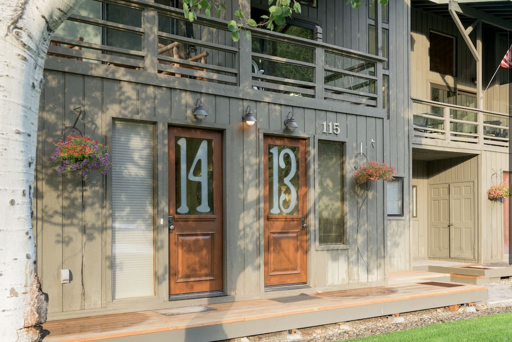Front Door of #13 with deck above.