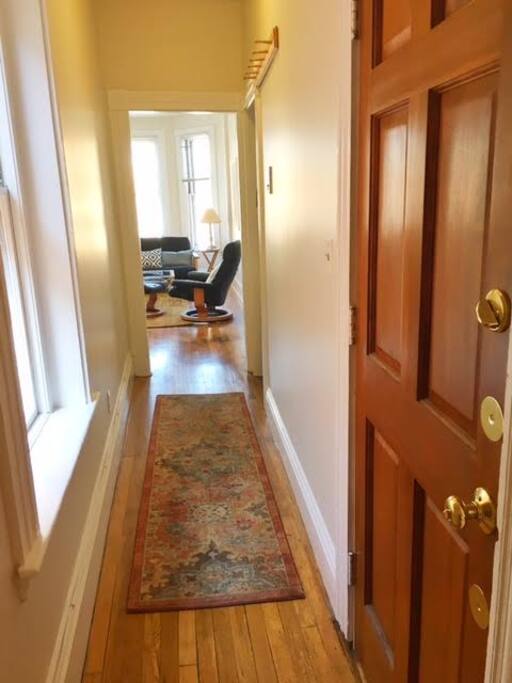 Just inside the front door looking down the hall to the living room.